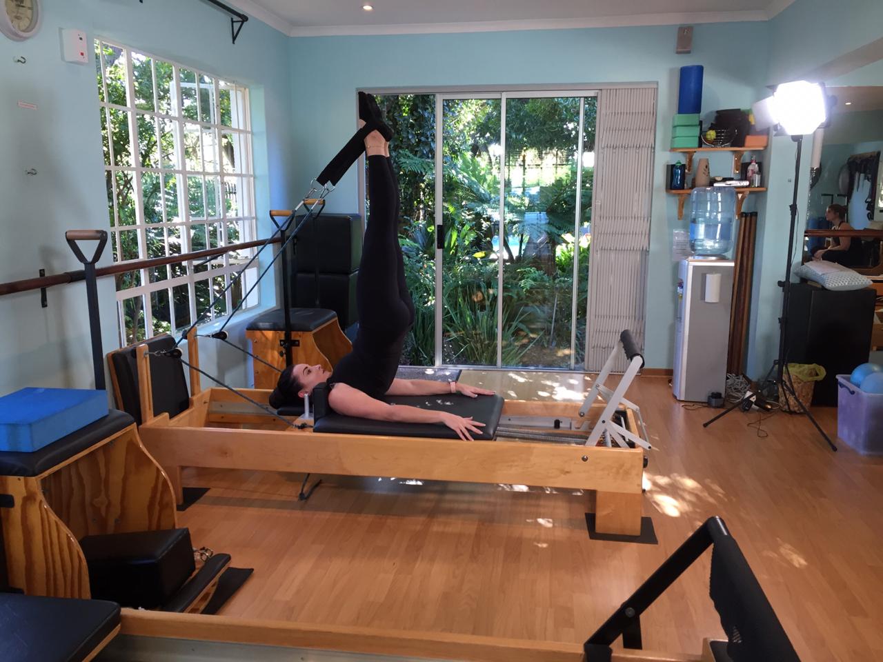 Blog Picture Lady using pilates workout bench