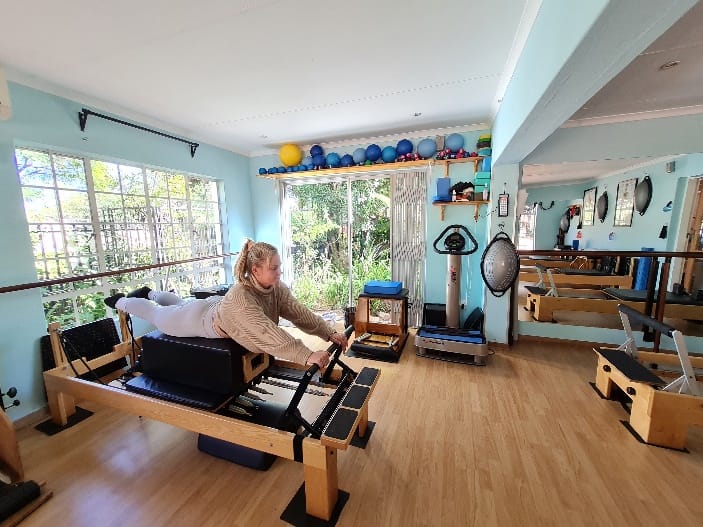 pilates workout bench Lady using pilates workout bench